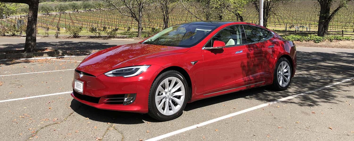 Red Tesla viewed from the front