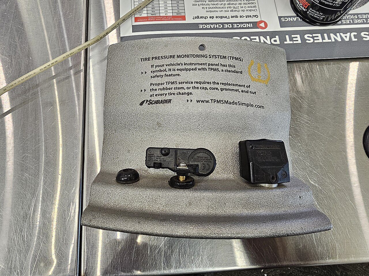 Different direct tire-pressure sensor assemblies on a display stand