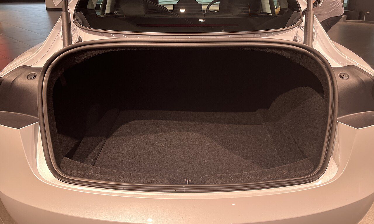Tesla Model 3 rear luggage opening with the perimeter seal and latch area visible
