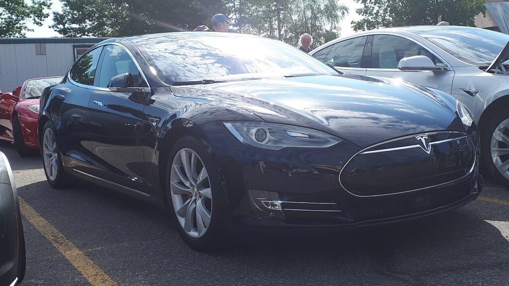 Dark Tesla Model S P85D parked outdoors