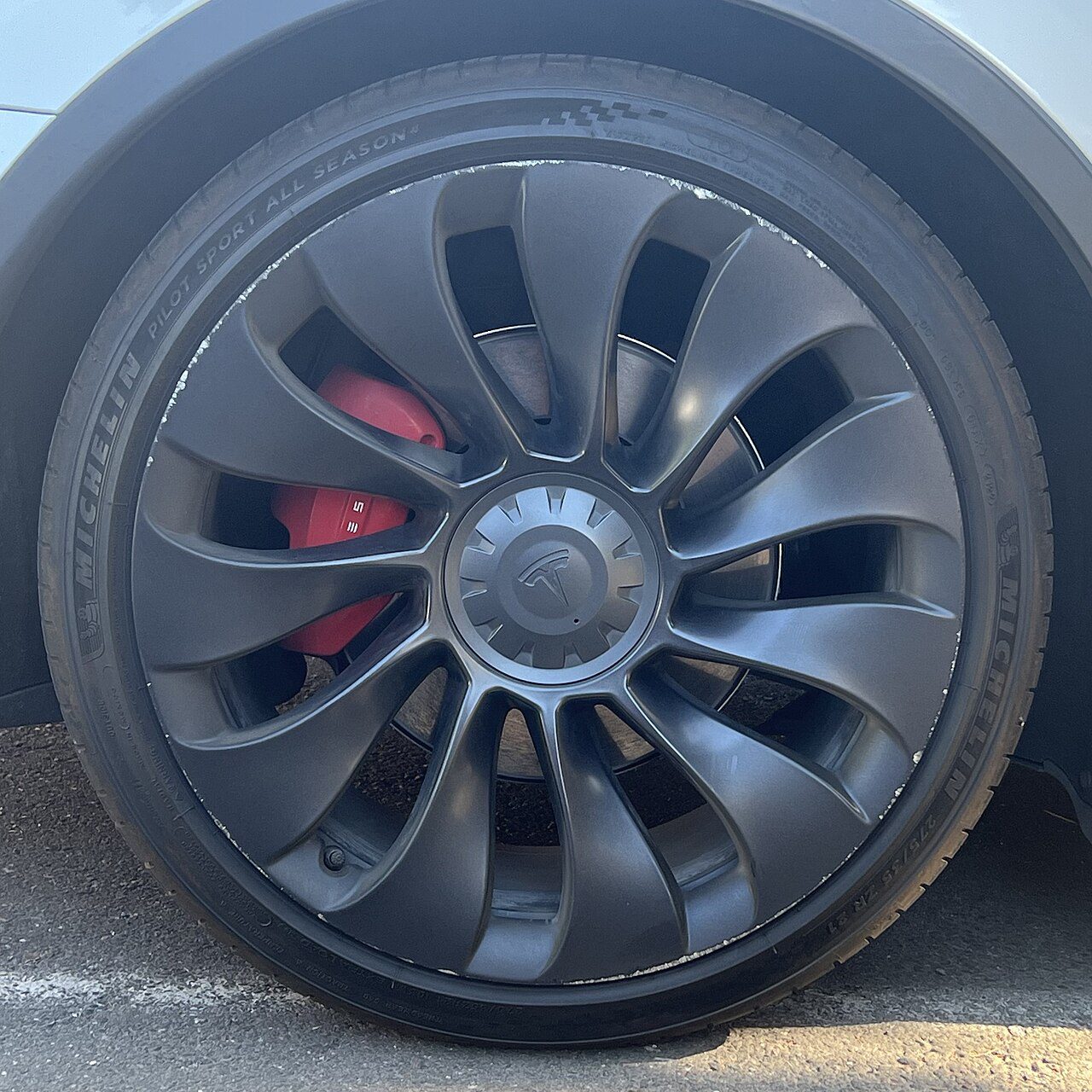 Tesla wheel showing the tire sidewall and external valve