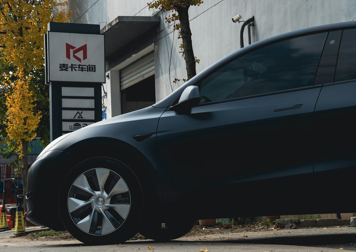 Black Tesla Model Y viewed from the side