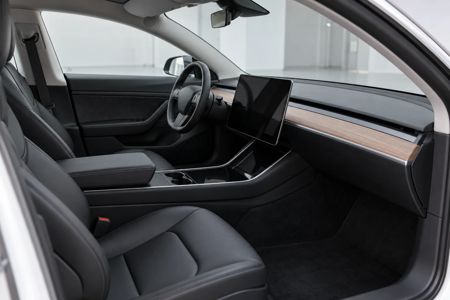 Representative Tesla cabin with the original central touchscreen switched off