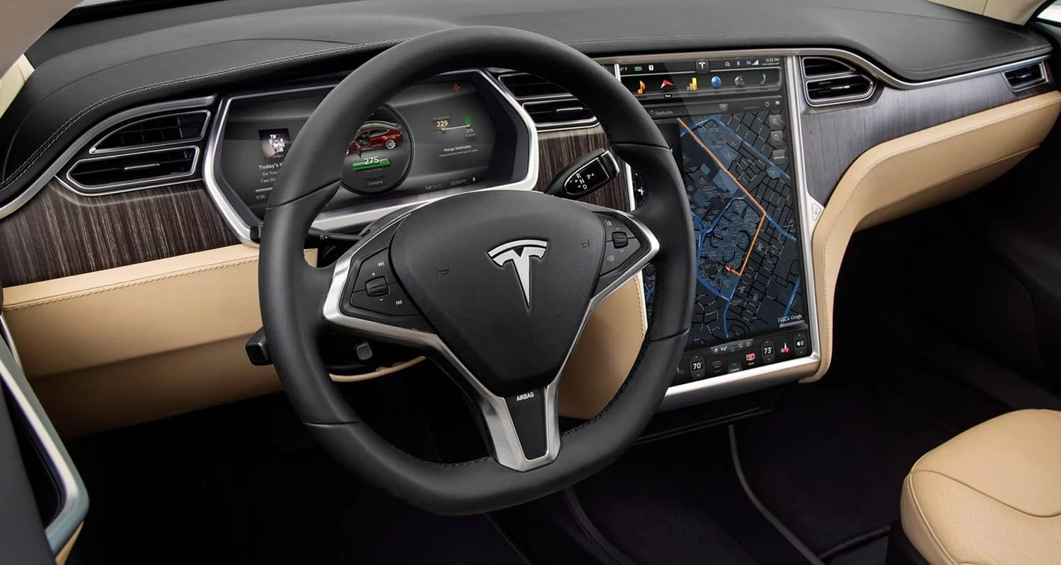 Tesla Model S dashboard with cabin air vents and touchscreen climate controls