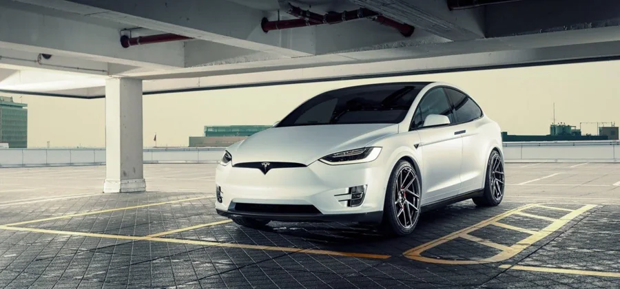 White Tesla Model X viewed from the front and side